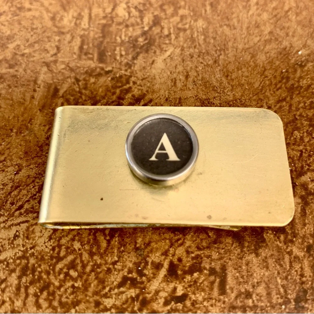 A vintage typewriter key money clip